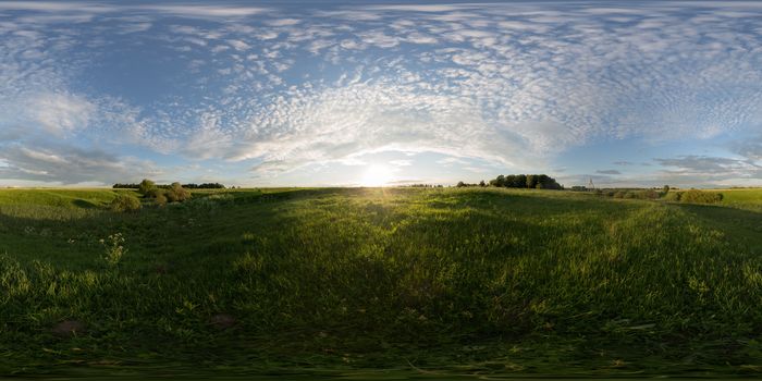 Sunset on meadow full spherical panorama. 360 by 180 degree angle of view in equirectangular projection. May be used in virtual reality or 3D-graphics content as photorealistic background.
