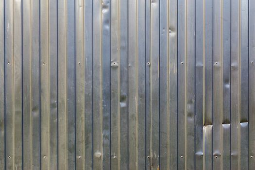 dusty galvanized profiled sheet flat background with vertical direction of rolling and landscape orientation of picture