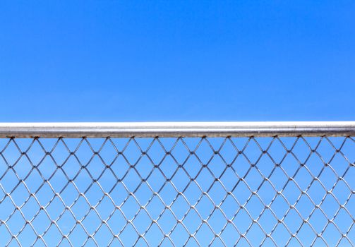 Metal mesh and blue sky background