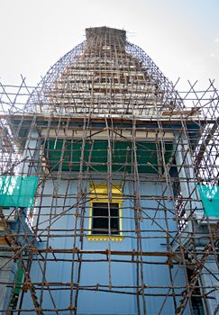 South Indian Temple covered with bamboo cage erected for painting work.