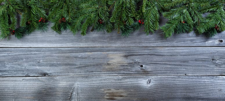 Christmas rustic natural wooden background with evergreen branches   