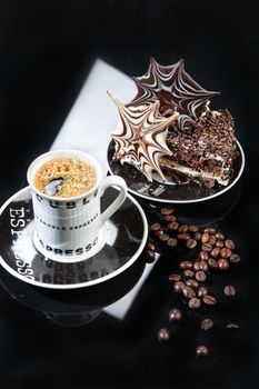 Cup of coffee and chocolate cake on a glass background