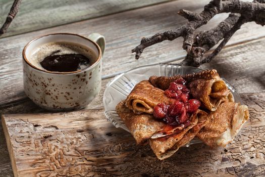 Pancakes on an old studio wooden background