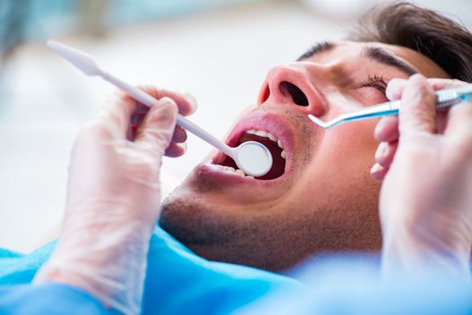 Man patient visiting dentist for regular check-up