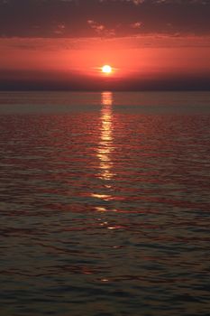 Sunset off the coast of the Greek island of Mykonos.