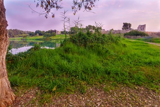 Sunset view of the lake, with the Antipatris Fort (Binar Bashi), in Yarkon (Tel Afek) National Park, central Israel