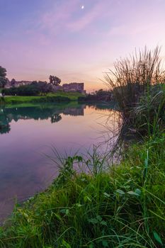 Sunset view of the lake, with the Antipatris Fort (Binar Bashi), in Yarkon (Tel Afek) National Park, central Israel