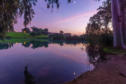 Sunset view of the lake, with the Antipatris Fort (Binar Bashi), in Yarkon (Tel Afek) National Park, central Israel