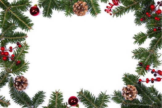 Christmas white blank card with copy space and frame decor of fir tree branch cones red holly berry bauble isolated on white background