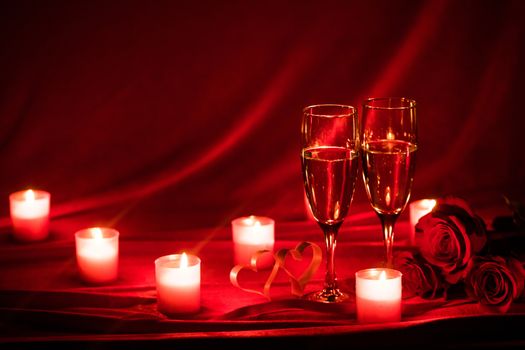 Valentines day background with champagne glasses roses candles and hearts