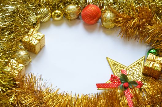 Christmas frame. Christmas balls, garland, red and golden decorations on white background. Flat lay, top view, copy space.