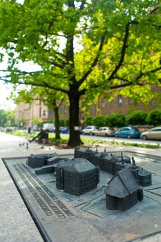 Mini map of the square in Krakow, made in the form of a sculpture on the street. A find for a tourist.. Krakow, Poland - 05.15.2019