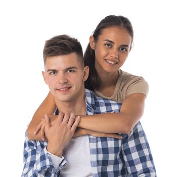 Smiling young couple embracing isolated on white background