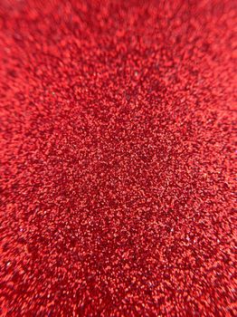 Red abstract glitter vertical texture background.