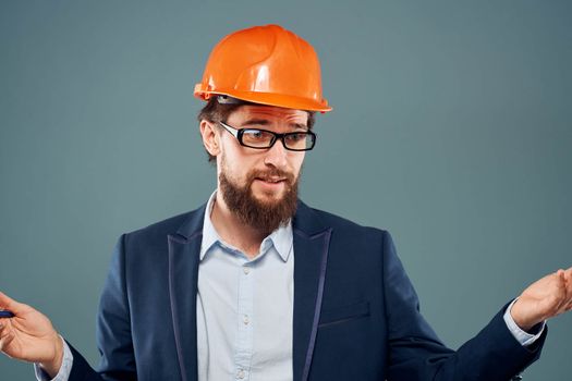 Man in orange paint construction engineer lifestyle cropped view. High quality photo