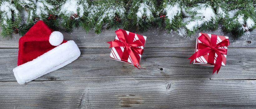 Merry Christmas concept on rustic natural wooden background with traditional holiday decorations    