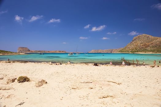 GRAMVOUSA - BALOS, THE CRETE ISLAND, GREECE - JUNE 4, 2019: The beautiful seaview and the people on the beach of Gramvousa.