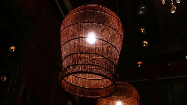 Vintage lamp in restaurant. Close up of lamp in restaurant. Indoor decoration. Interior lights.