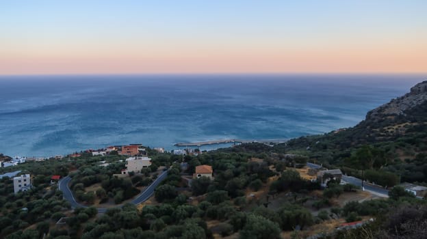 Libyan sea and road with bends at the sunset seen from Great Sea View, Viannos, Greece