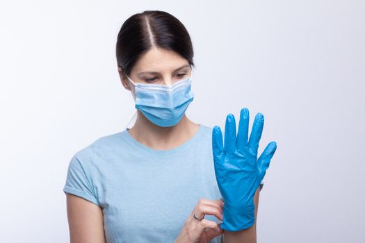 Nurse or doctor profesional uniform with face mask wear and checking protective gloves stock photo