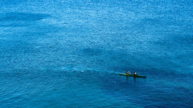 Kayak with people exploring the sea - Libyan sea, Crete