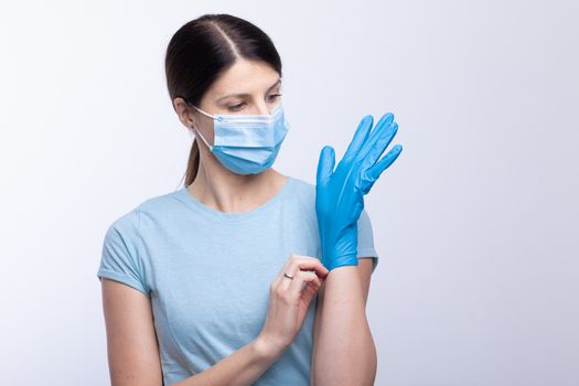 Nurse or doctor profesional uniform with face mask wear and checking protective gloves stock photo