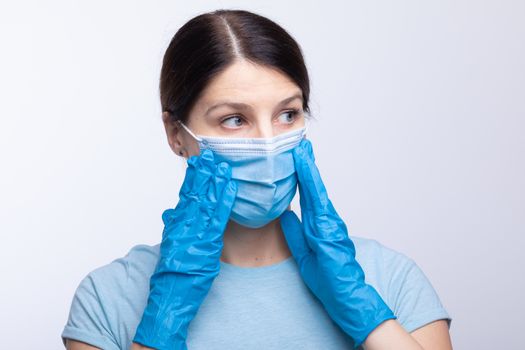 Nurse or doctor wearing and checking protective equipment against viruses and bacterial disease stock photo