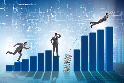 Business people jumping over bar charts