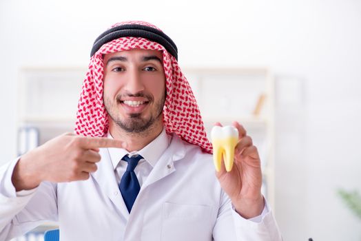 Arab dentist working on new teeth implant