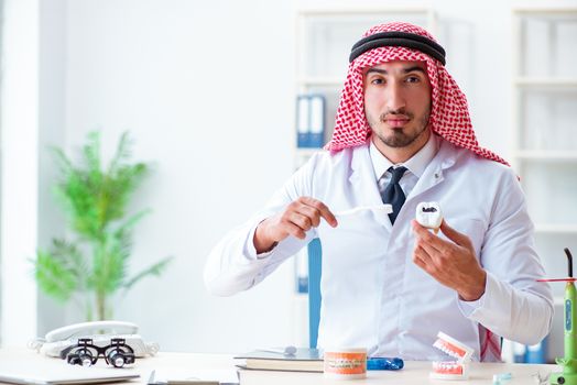 Arab dentist working on new teeth implant