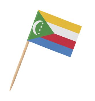 Small paper flag of the Comoros on wooden stick, isolated on white