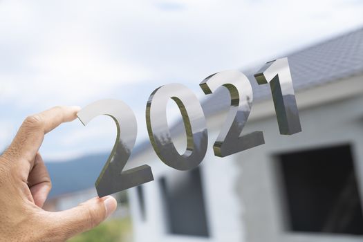 People man hand holding numbers 2021 Metaphor In the new year 2021 festival With open window To get To success In the business world Count down change 2020 to 2021 year