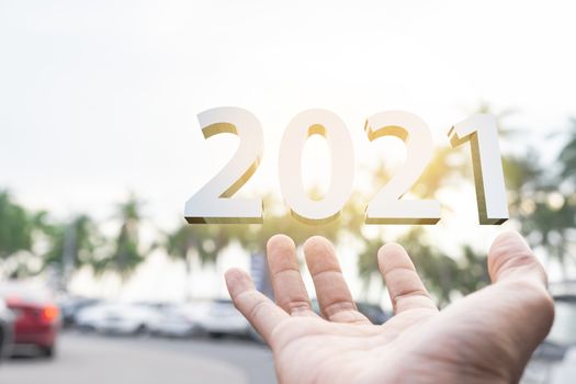 People man hand holding numbers 2021 Metaphor In the new year 2021 festival With scenic scenery In the forest Mountain and fog of Beangsan Thailand Count down change 2020 to 2021 year