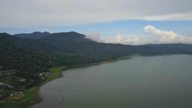 Aerial view to lake Buyan, caldera lake at Bali. Beautiful lake with turquoise water in the mountains of the island of Bali.