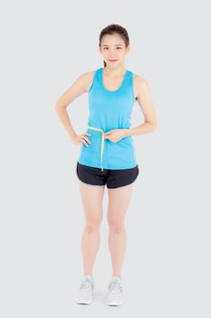 Beautiful slim young asian woman measuring tape thin waist wear uniform fitness isolated white background, asia girl loss weight for diet with exercise and workout wellbeing and healthy care body.