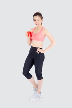 Beautiful young asian woman in sport after workout drinking water from glass for thirsty isolated on white background, girl after exercise drink coffee or tea for hydration and refresh with healthy.