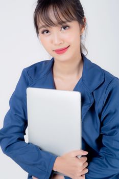 Beautiful portrait young asian business woman holding laptop computer isolated on white background, businesswoman using notebook, asia freelance girl work job surfing internet online or sending email.