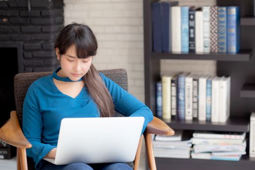 Business young asian woman freelance work on display laptop computer on chair, businesswoman check email, asia girl searching to internet communication and business concept.