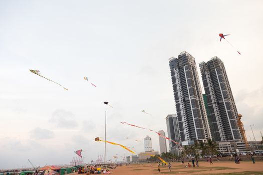 Colombo Sri Lanka 4.25.2018 People flying kites at sunset on Galle Fort Road seafront Colombo. High quality photo