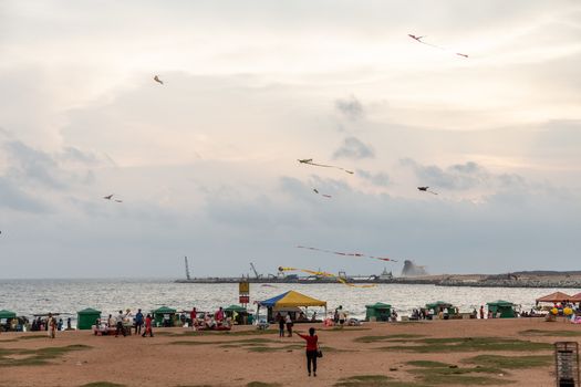 Colombo Sri Lanka 4.25.2018 People flying kites at sunset on Galle Fort Road seafront Colombo. High quality photo