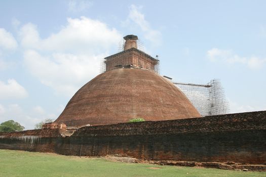 Sri Lanka, Buddhist stupa traditional brick under renovation near Polonnaruwa . High quality photo