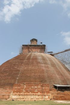 Sri Lanka, Buddhist stupa traditional brick under renovation near Polonnaruwa . High quality photo