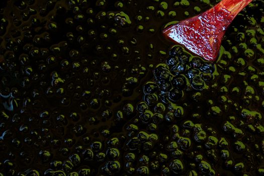 Chokeberry berries on the surface in chokeberry jam. Zavidovici, Bosnia and Herzegovina.