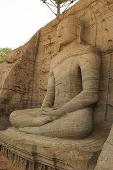 Polonnaruwa Sri Lanka Ancient ruins Statue sitting of Buddha in lotus position . High quality photo