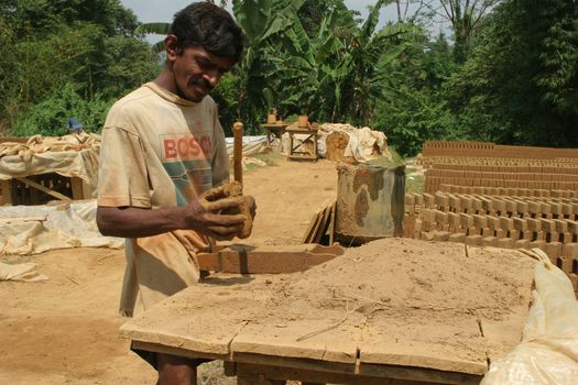 Sri Lanka 4.5.2006 manufacture of traditional mud bricks for building. High quality photo