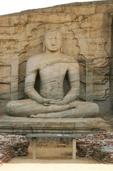 Polonnaruwa Sri Lanka Ancient ruins Statue sitting of Buddha in lotus position . High quality photo