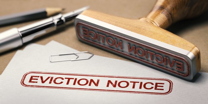 3D illustration of a rubber stamp with the text eviction notice printed on a document.