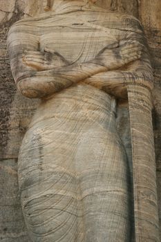 Polonnaruwa Sri Lanka Ancient ruins Statues of Buddha standing with crossed arms . High quality photo