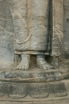 Polonnaruwa Sri Lanka Ancient ruins Statues of Buddha standing with crossed arms . High quality photo