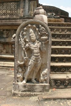 Polonnaruwa Sri Lanka Ancient ruins Statues at entrance to shrine beside stairs . High quality photo